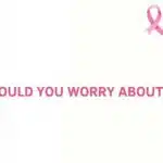 Woman checking for a breast lump and breast cancer symptoms